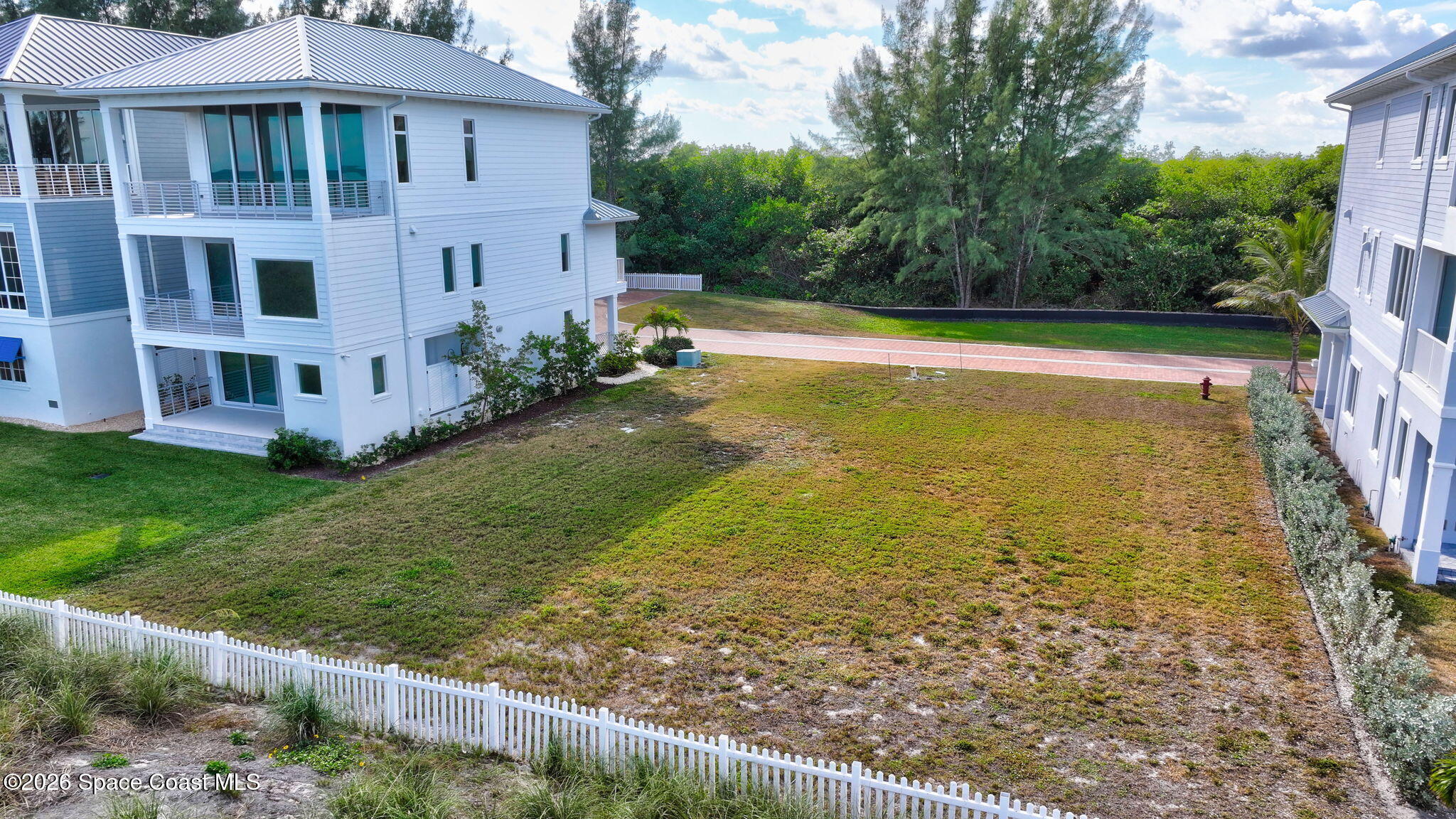 5144 Watersong Way Fort Pierce, FL 34949 - Photo 14 of 29 a view of a swimming pool with a garden