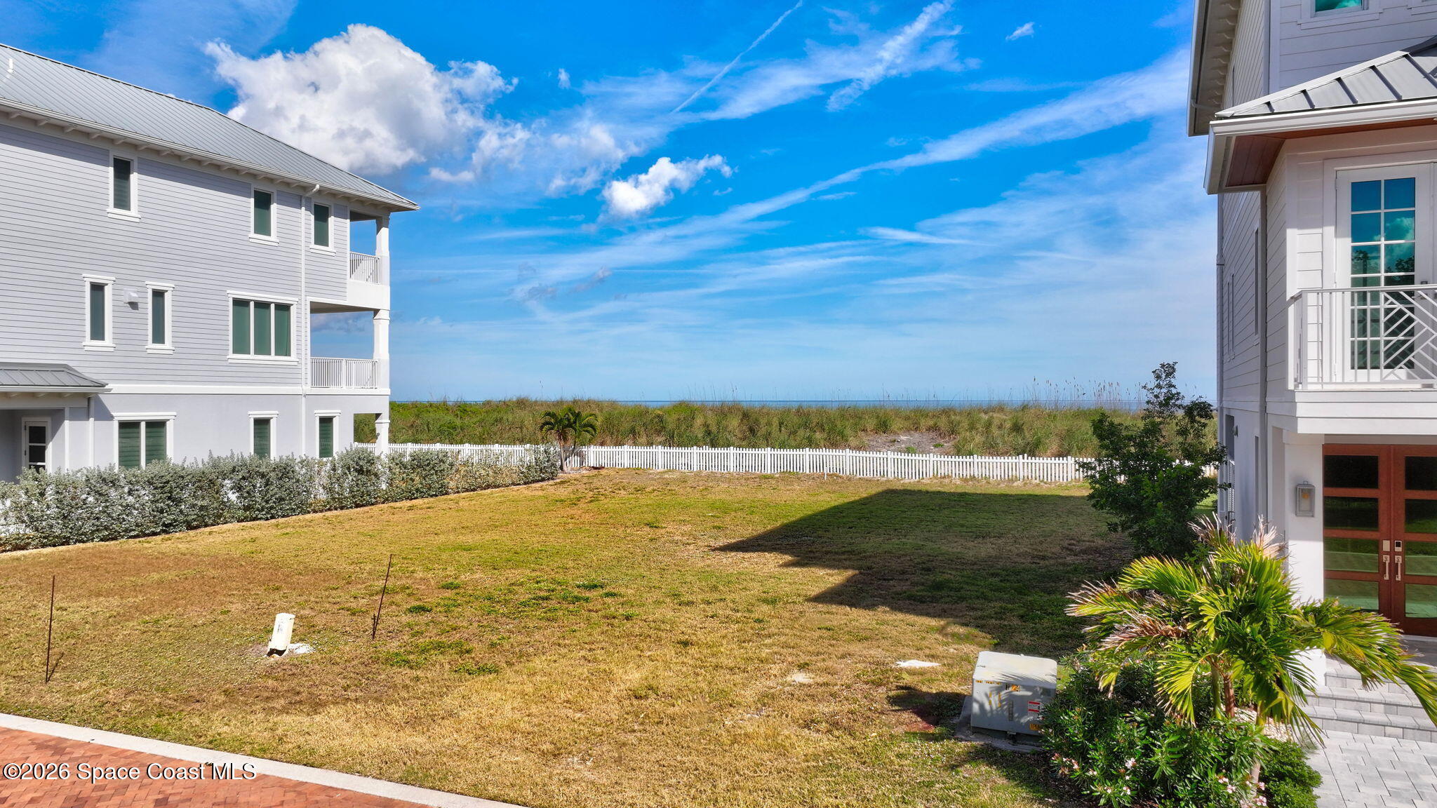 5144 Watersong Way Fort Pierce, FL 34949 - Photo 16 of 29 a view of an ocean with a building in the background