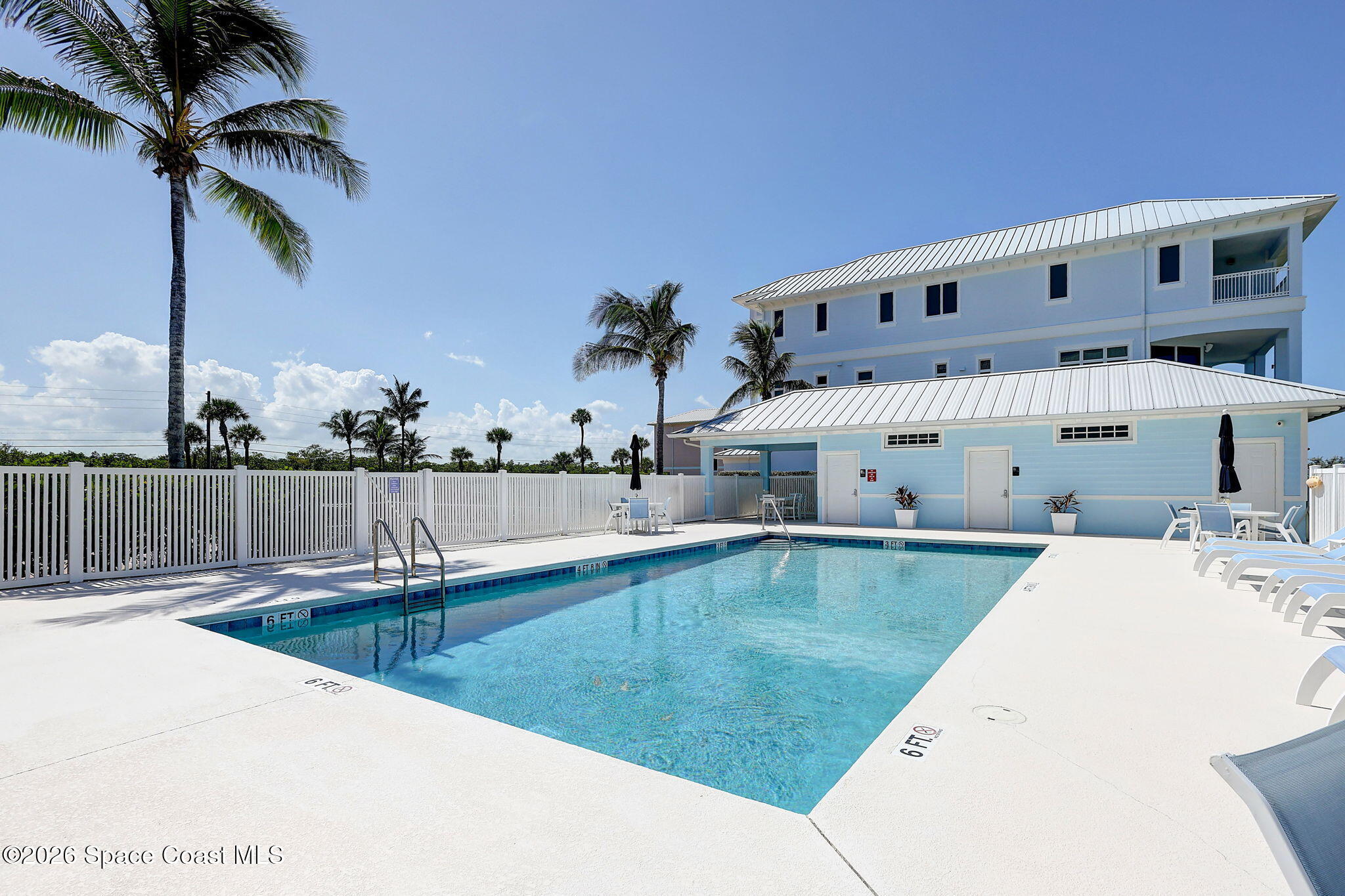 5144 Watersong Way Fort Pierce, FL 34949 - Photo 19 of 29 a view of a swimming pool with a chair