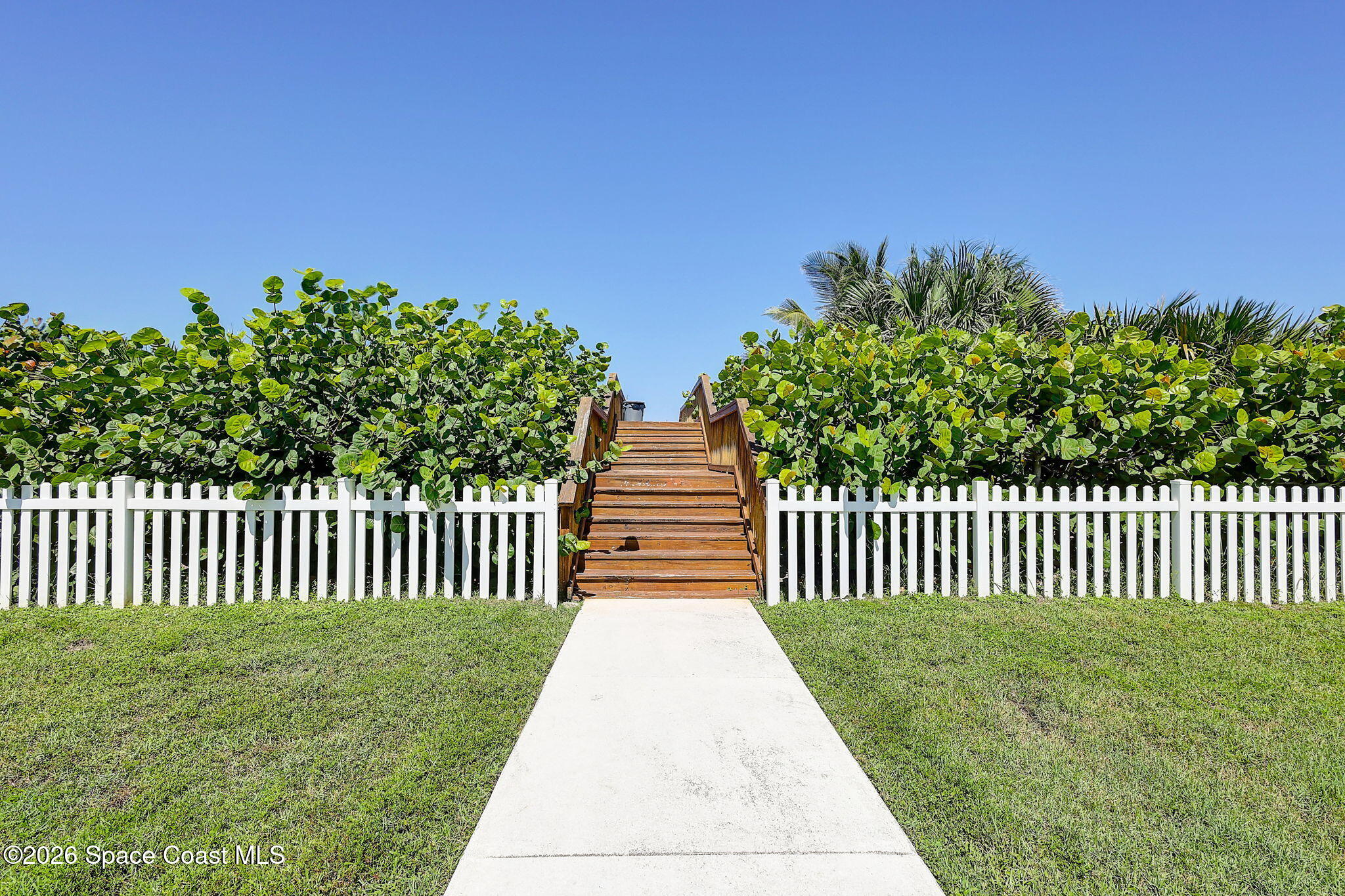 5144 Watersong Way Fort Pierce, FL 34949 - Photo 25 of 29 a view of a yard with wooden fence