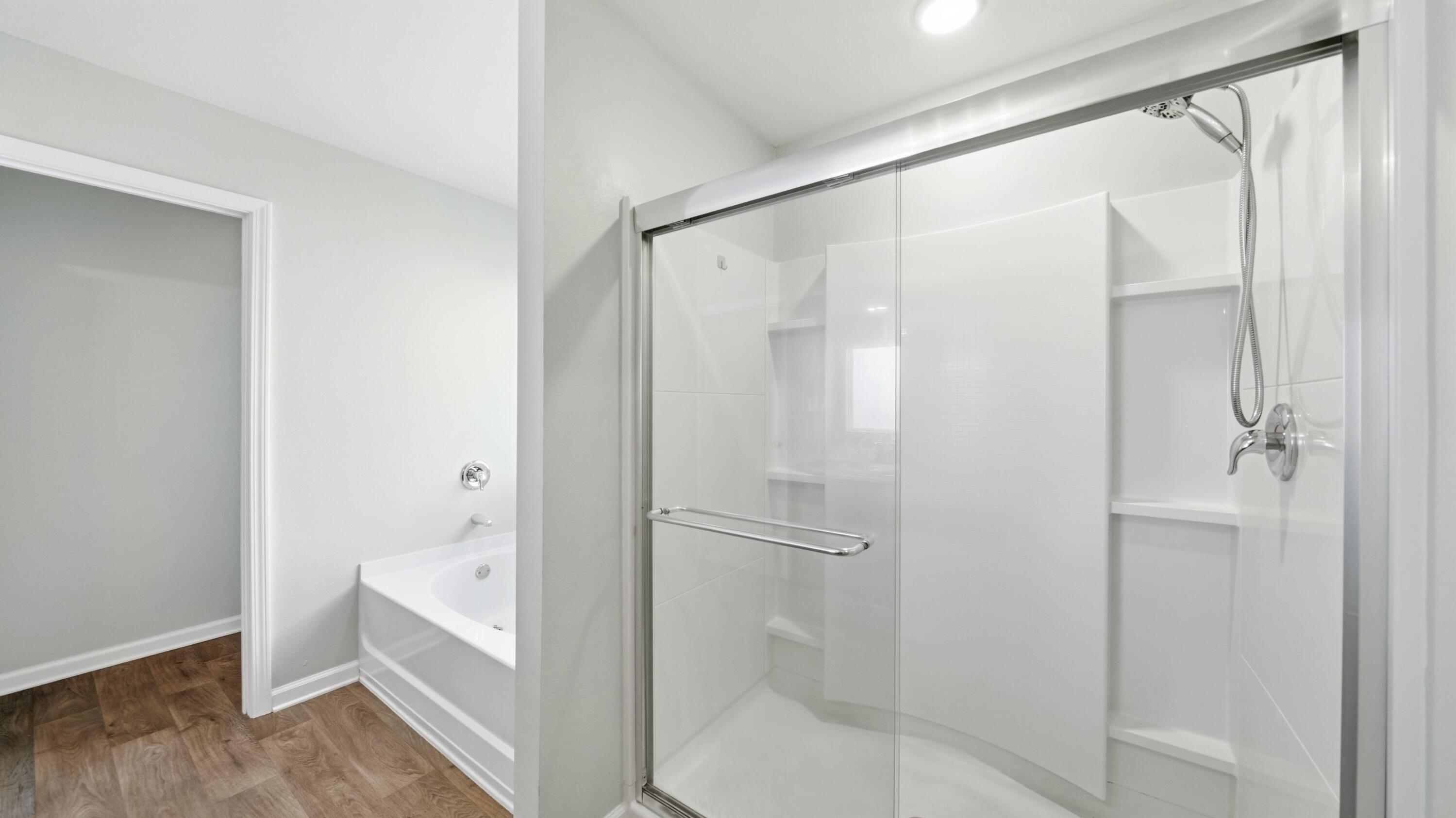 3927 Alva Thomas Road Panama City, FL 32404 - Photo 14 of 46 a bathroom with a bathtub and a shower