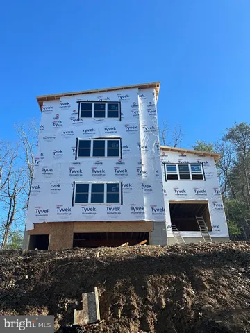 a front view of a building with parking space