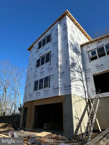 a front view of a house with parking space