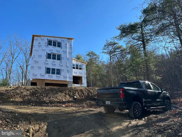 a view of a car park in front of house