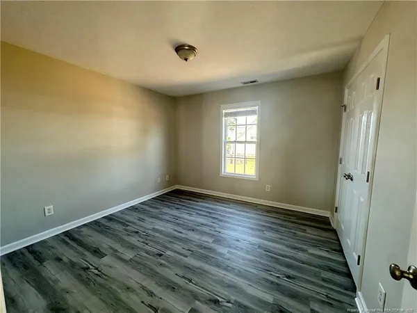 a view of an empty room and window