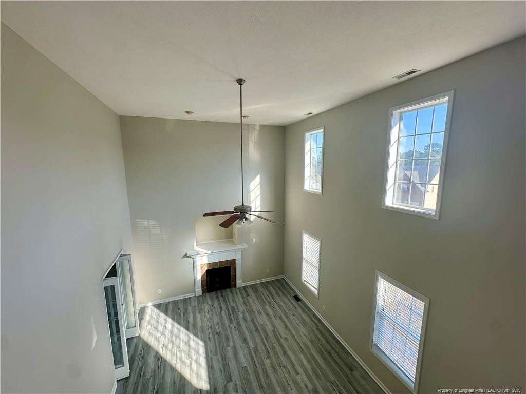 11 Lattimore Road Cameron, NC 28326 - Photo 17 of 18 a view of a room with wooden floor wooden cabinet and windows