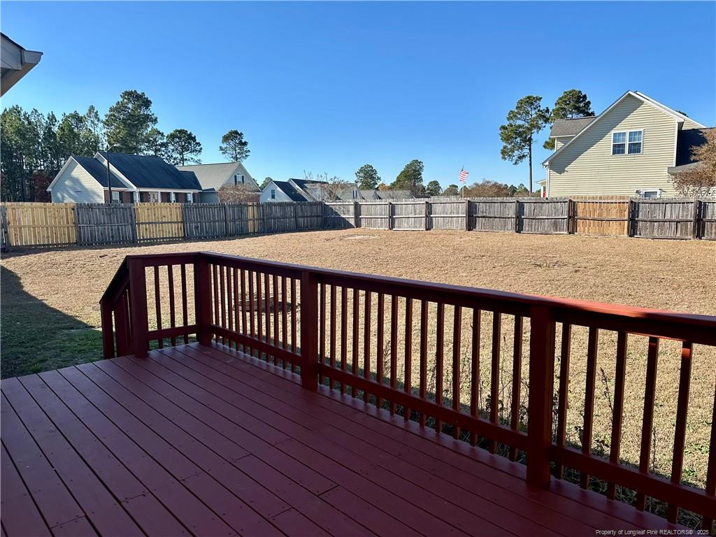 11 Lattimore Road Cameron, NC 28326 - Photo 18 of 18 a view of a balcony with wooden floor and potted plants