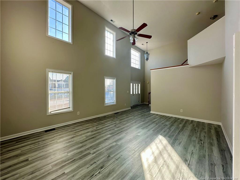 11 Lattimore Road Cameron, NC 28326 - Photo 2 of 18 wooden floor in an empty room with a window