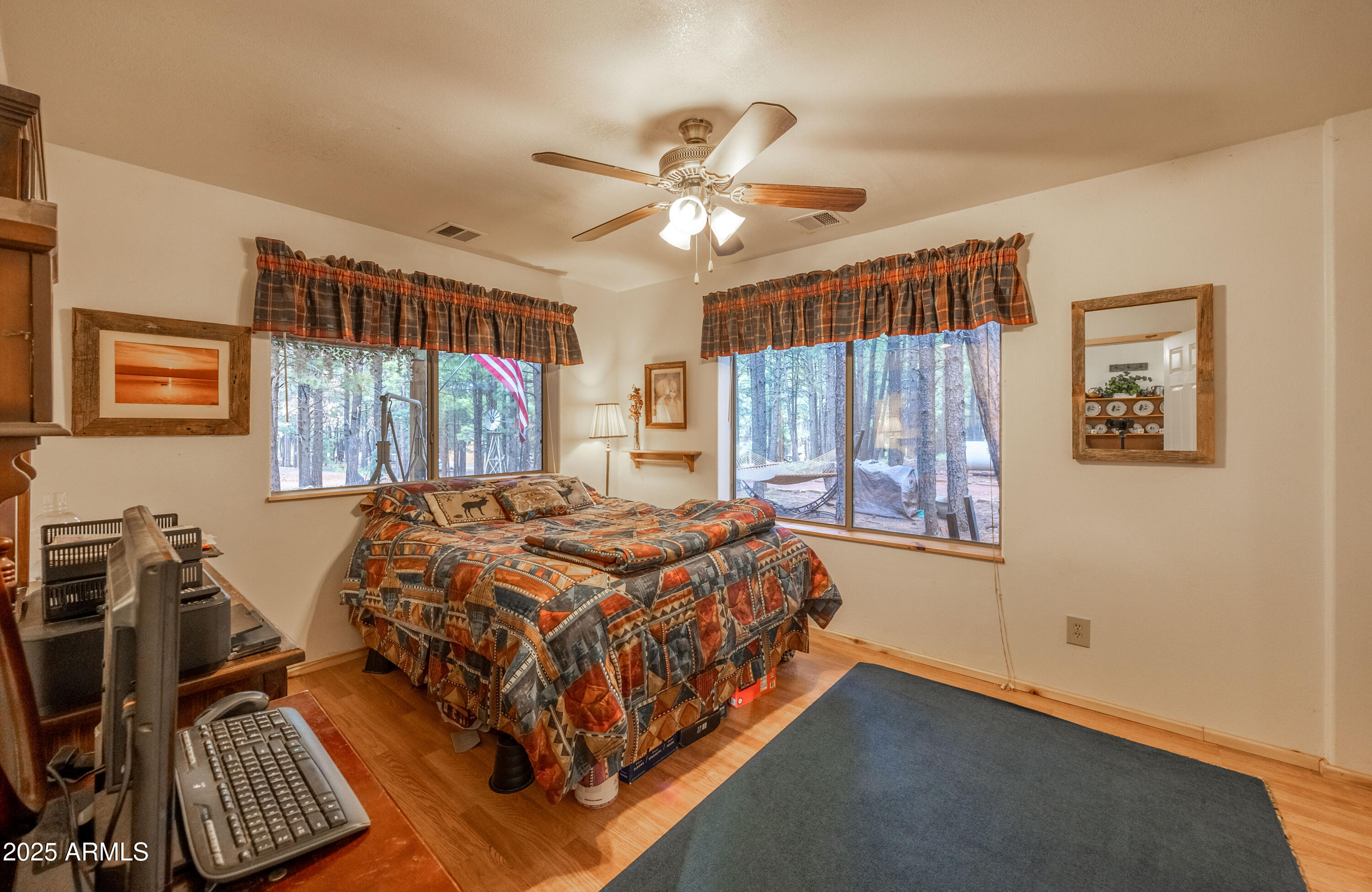 1643 Rifle Way Forest Lakes, AZ 85931 - Photo 8 of 40 a bed sitting in a bedroom next to a window