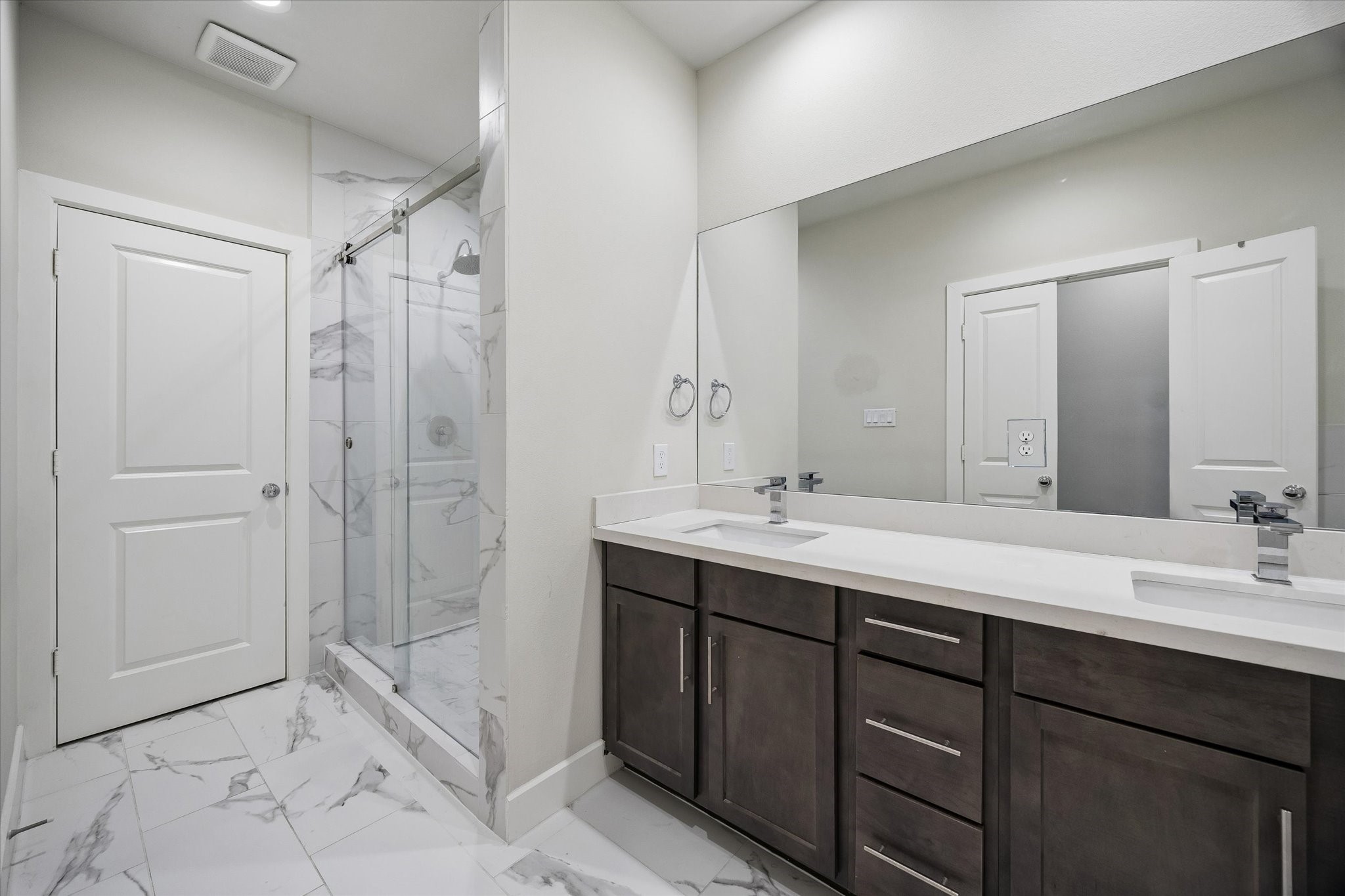 5914 Haring Lane Houston, TX 77091 - Photo 8 of 11 a bathroom with a double vanity sink mirror double and shower
