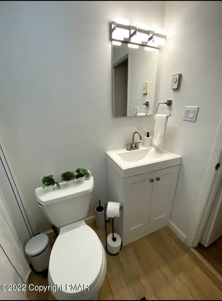 124 Bull Run Long Pond, PA 18334 - Photo 16 of 26 a white toilet sitting next to a bathroom sink
