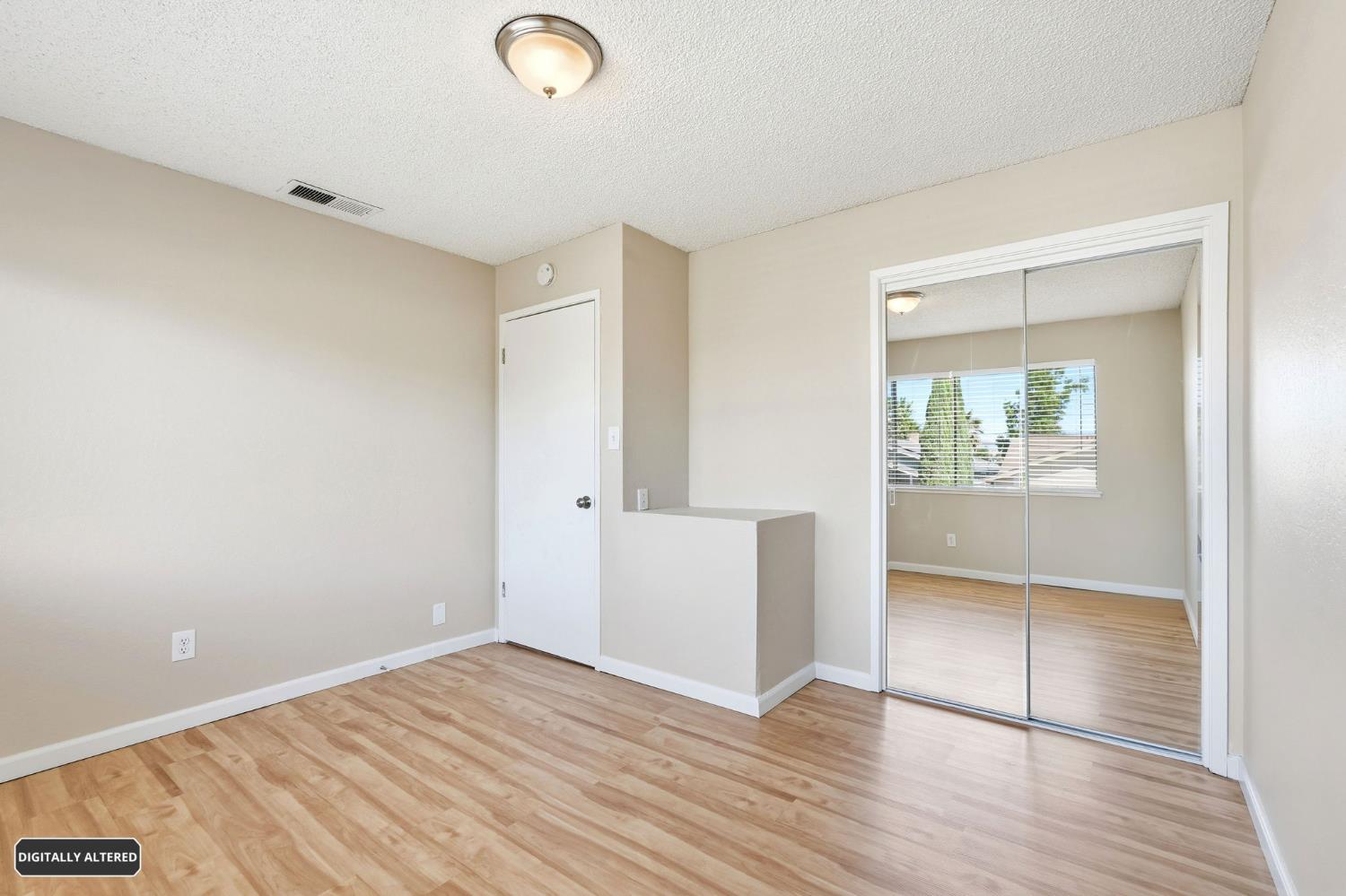 5501 Riverlake Road Discovery Bay, CA 94505 - Photo 50 of 60 an empty room with wooden floor and windows