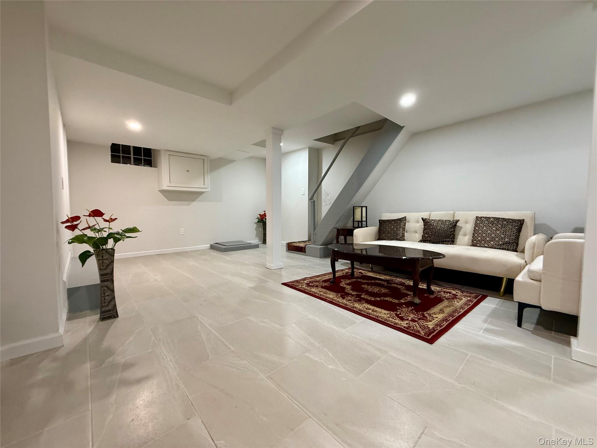 54-05 68th Street Queens, NY 11378 - Photo 25 of 47 Basement fully renovated with recessed lighting and stairs