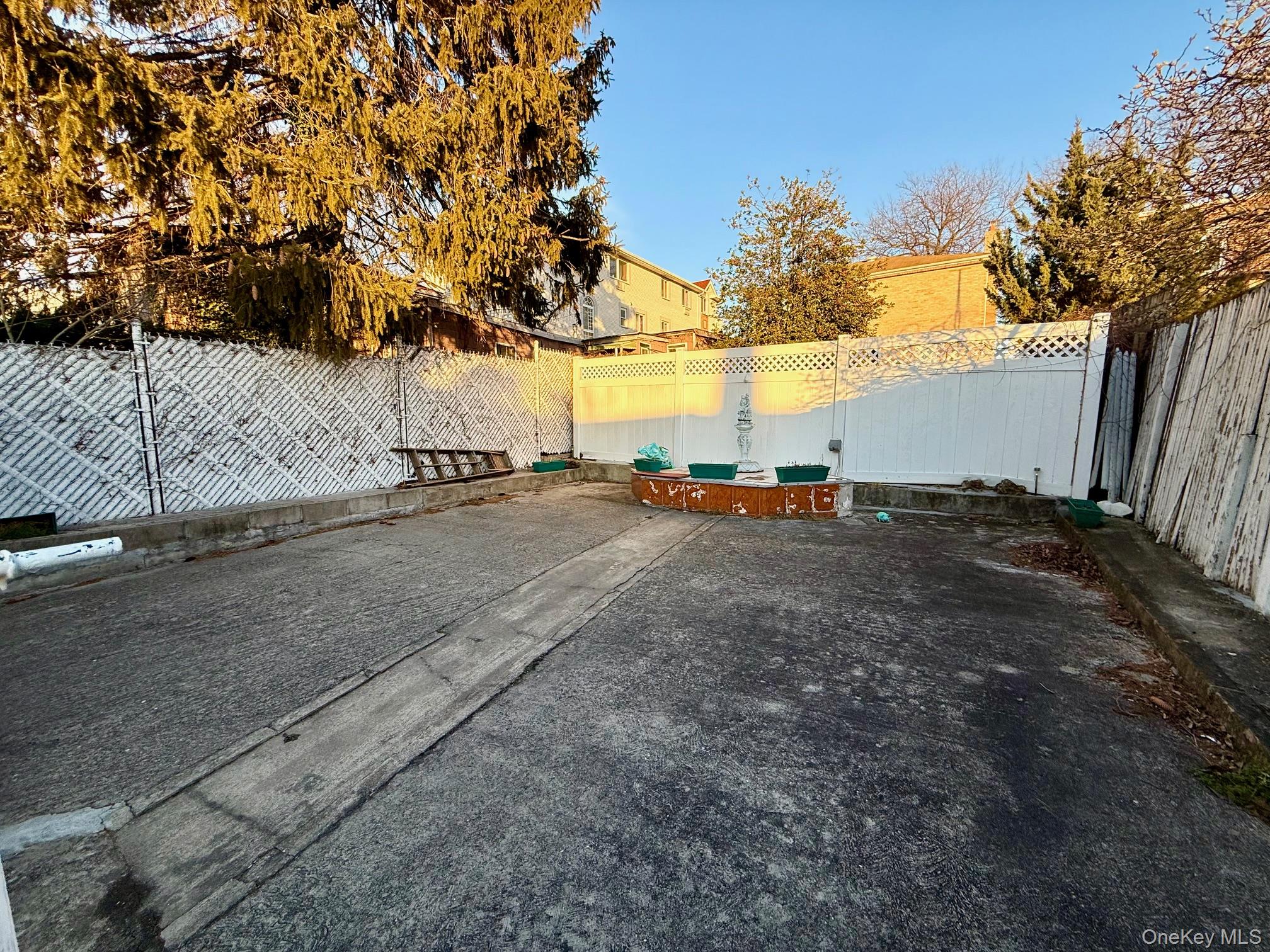 54-05 68th Street Queens, NY 11378 - Photo 3 of 47 View of fenced backyard