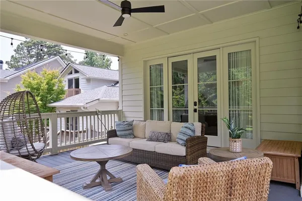a view of backyard with a deck and a garden