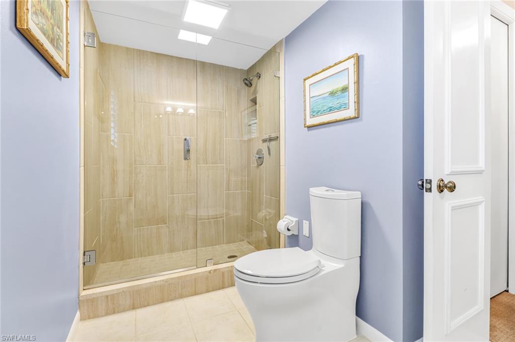 3200 Binnacle Drive, Unit D3 Naples, FL 34103 - Photo 17 of 25 a bathroom with a toilet and a shower