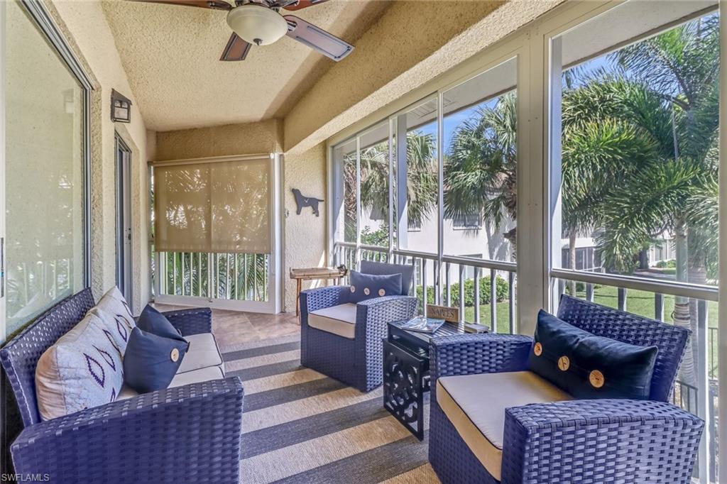 3200 Binnacle Drive, Unit D3 Naples, FL 34103 - Photo 21 of 25 a living room with furniture and a floor to ceiling window