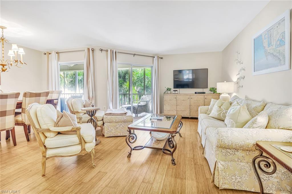 3200 Binnacle Drive, Unit D3 Naples, FL 34103 - Photo 9 of 25 a living room with furniture and a flat screen tv
