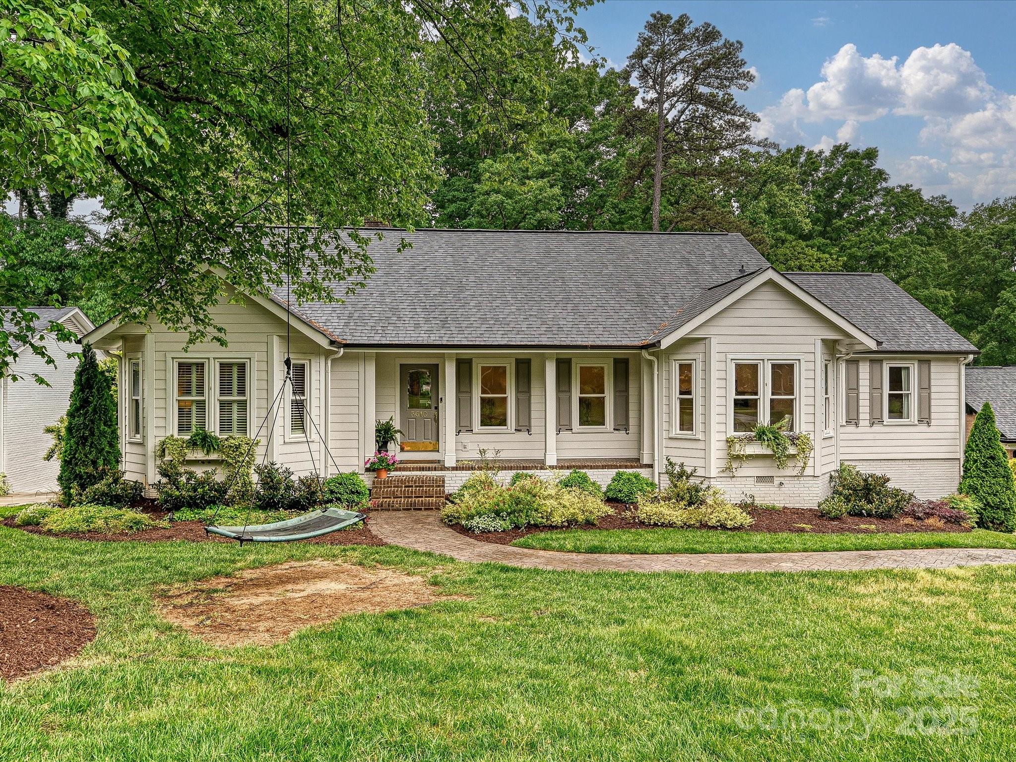 3610 Mill Pond Road Charlotte, NC 28226 - Photo 1 of 35 a front view of a house with garden