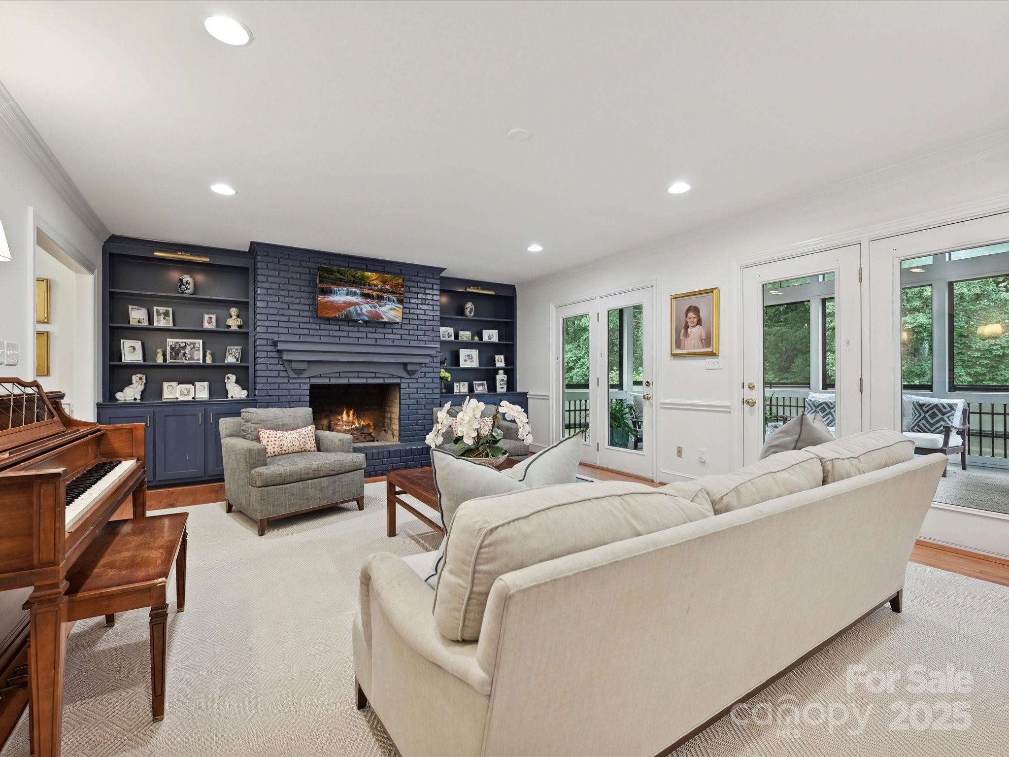 3610 Mill Pond Road Charlotte, NC 28226 - Photo 13 of 35 a living room with furniture a fireplace and a flat screen tv