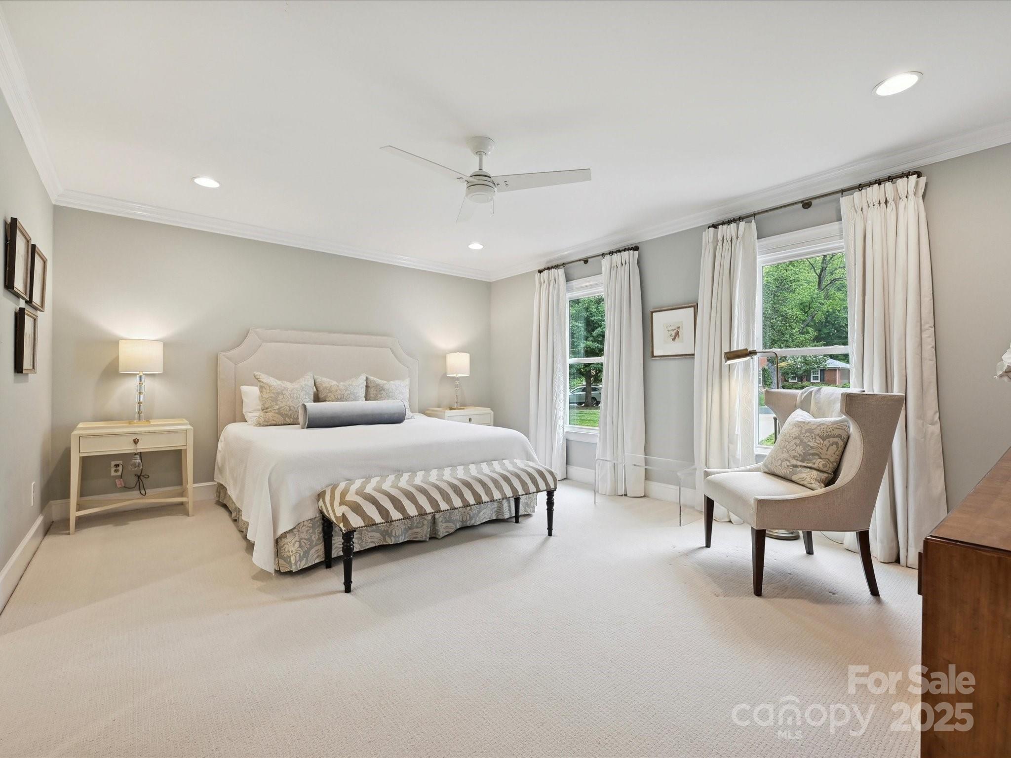 3610 Mill Pond Road Charlotte, NC 28226 - Photo 18 of 35 a bedroom with a bed chairs and a larger window