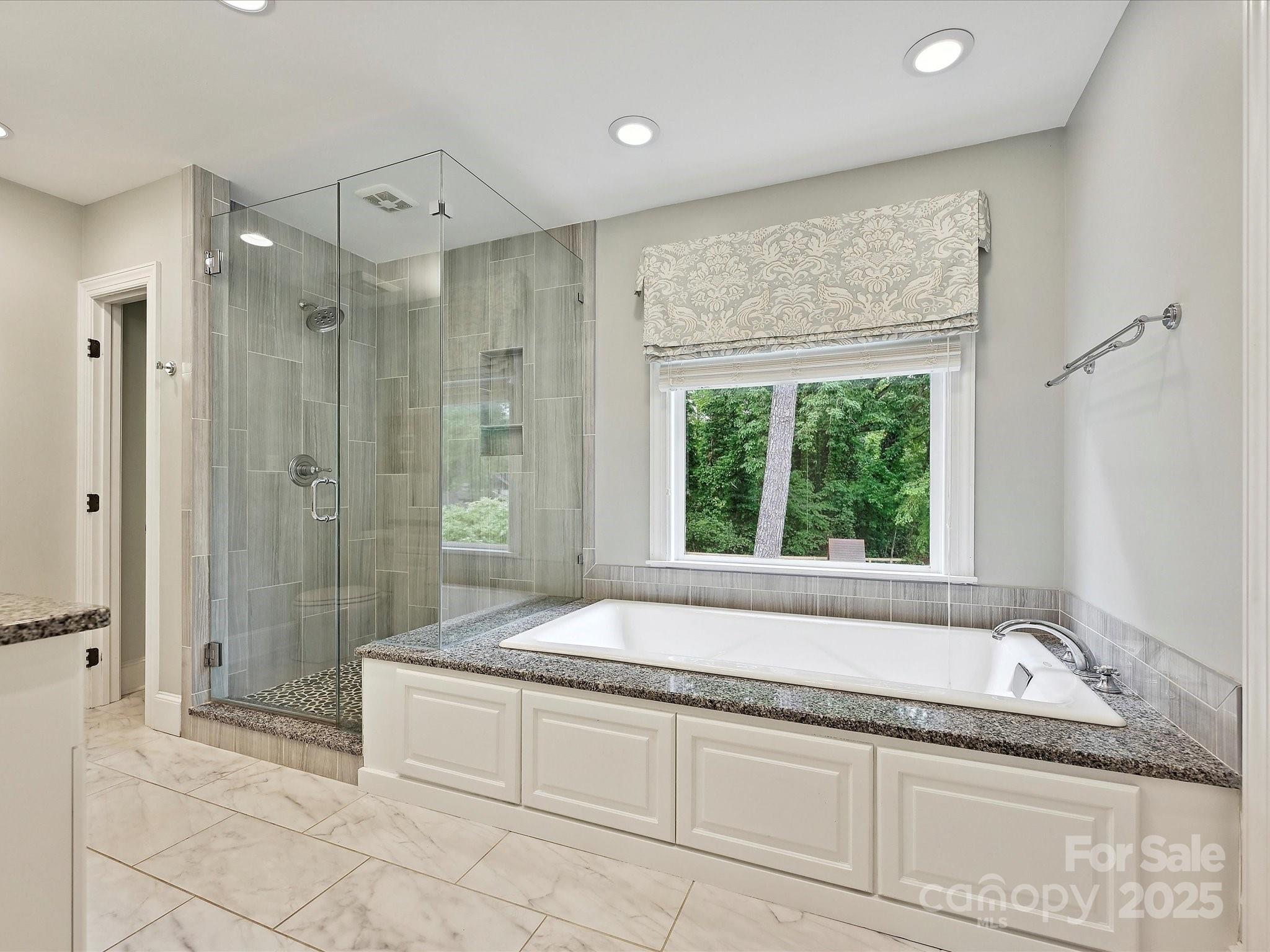 3610 Mill Pond Road Charlotte, NC 28226 - Photo 19 of 35 a spacious bathroom with a granite countertop tub shower and sink