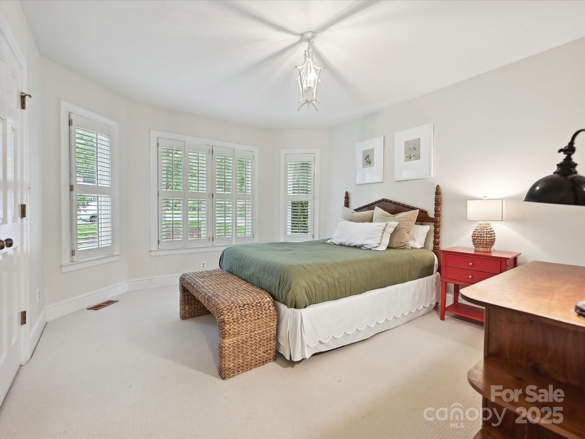 3610 Mill Pond Road Charlotte, NC 28226 - Photo 20 of 35 a bedroom with a bed and window