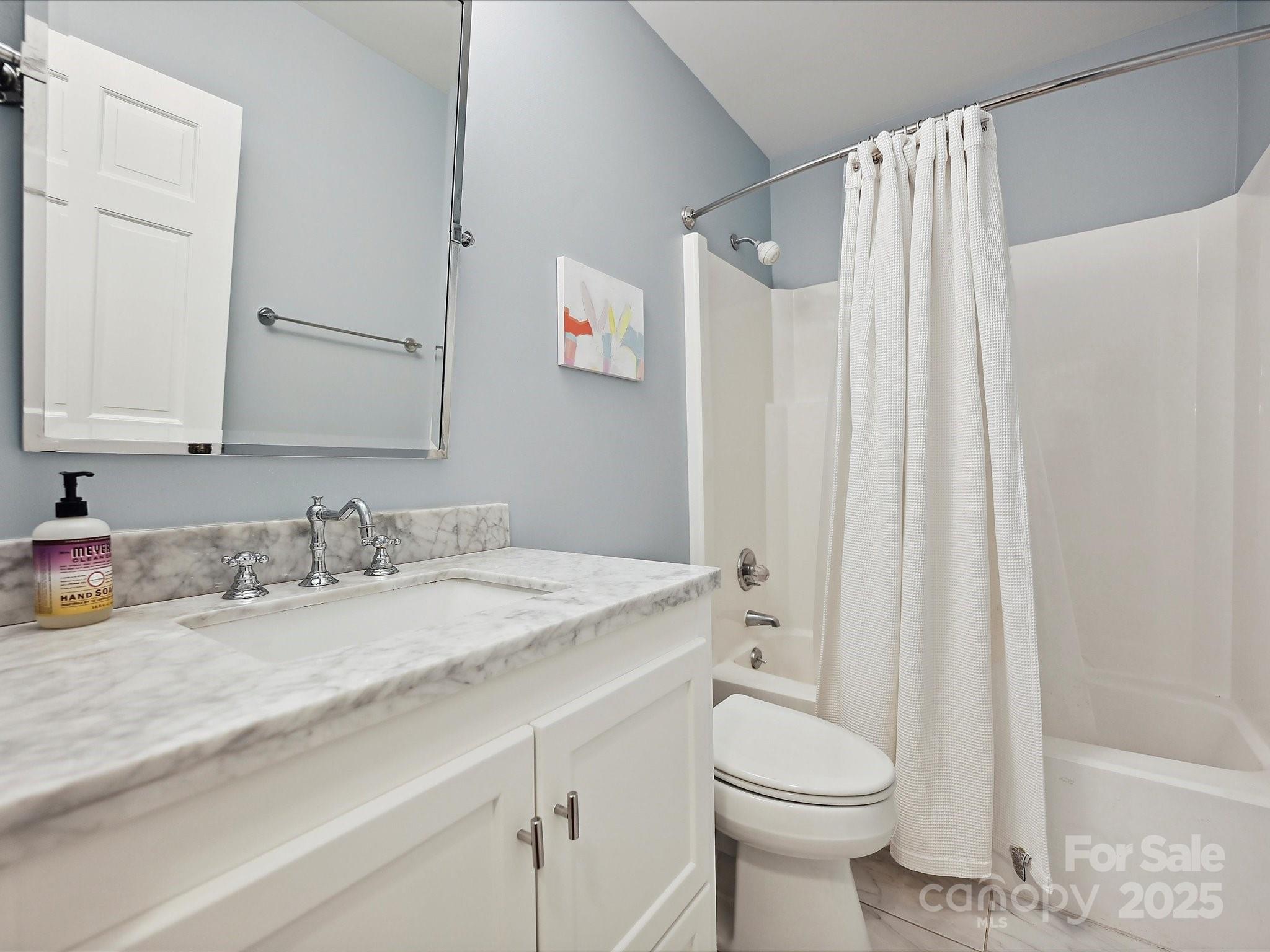 3610 Mill Pond Road Charlotte, NC 28226 - Photo 21 of 35 a bathroom with a sink a toilet and a mirror