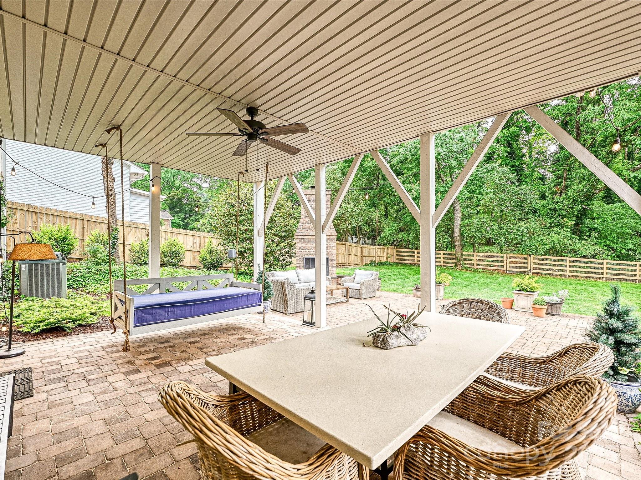 3610 Mill Pond Road Charlotte, NC 28226 - Photo 29 of 35 a view of a patio with a table chairs and backyard