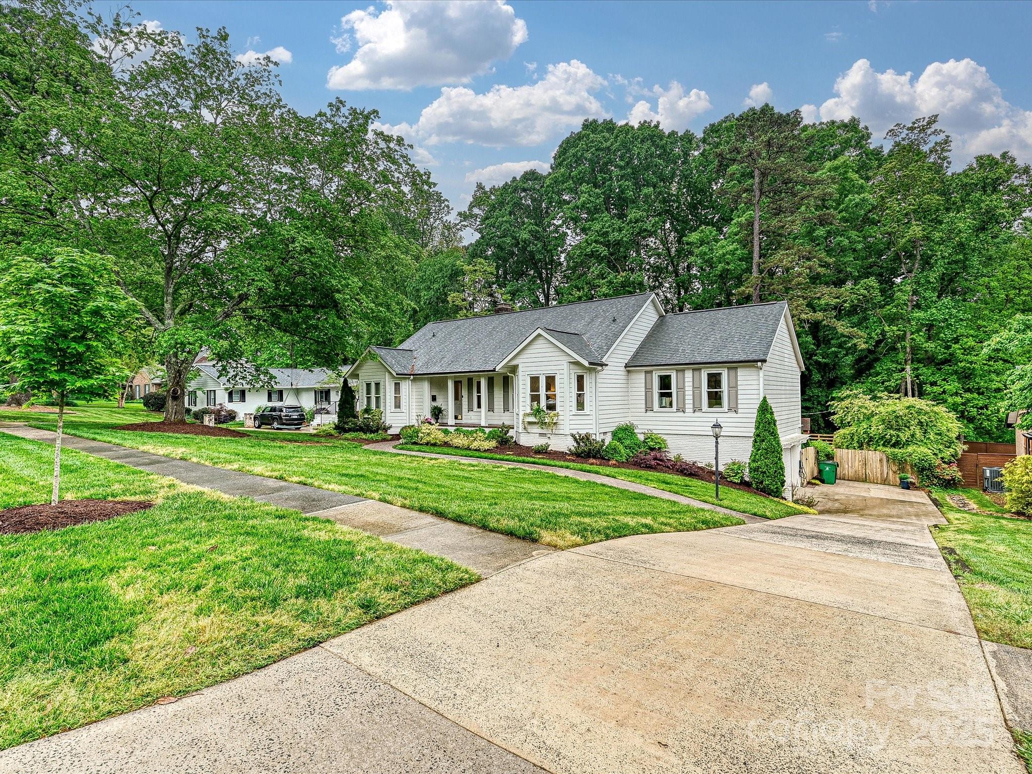 3610 Mill Pond Road Charlotte, NC 28226 - Photo 35 of 35 a front view of a house with garden