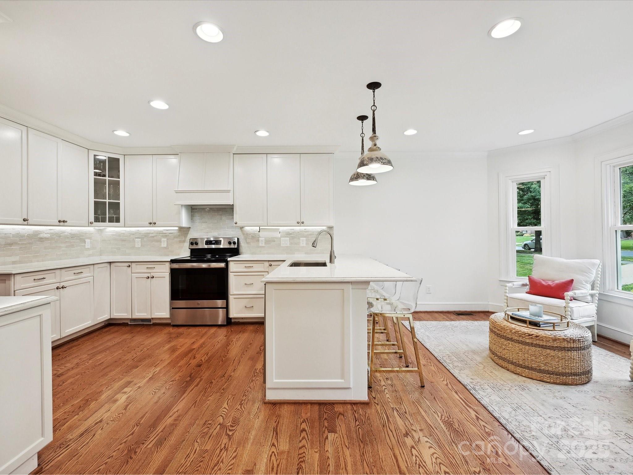 3610 Mill Pond Road Charlotte, NC 28226 - Photo 7 of 35 a kitchen with a sink and wooden floor