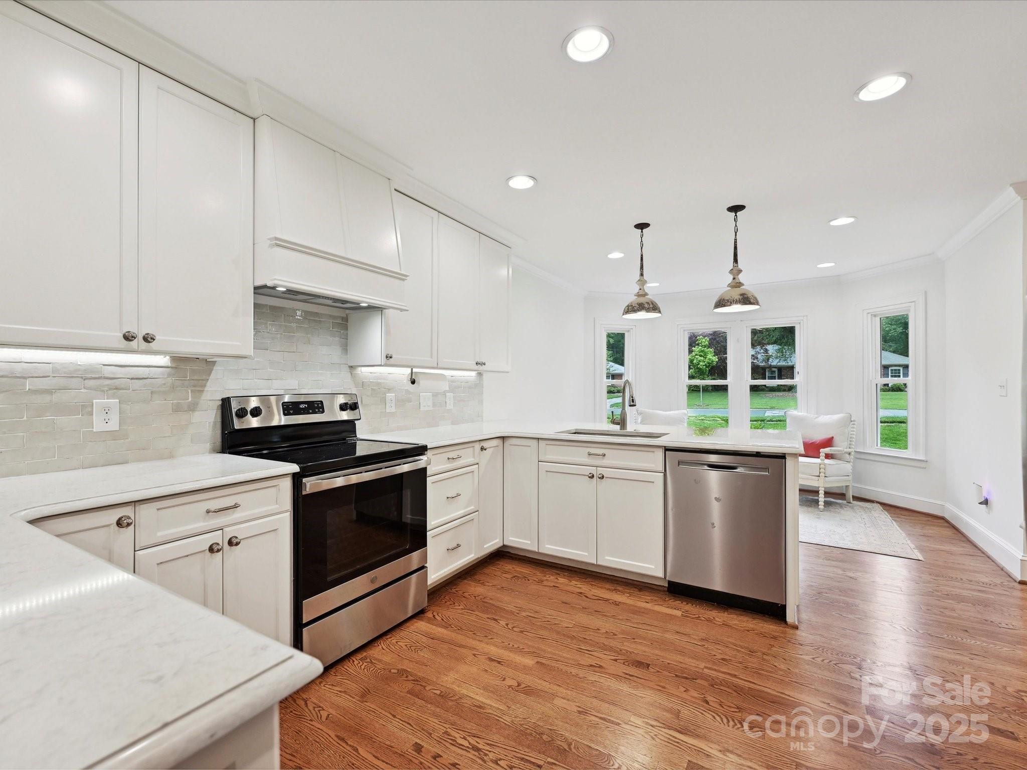 3610 Mill Pond Road Charlotte, NC 28226 - Photo 8 of 35 a kitchen with stainless steel appliances granite countertop a sink a stove and a refrigerator