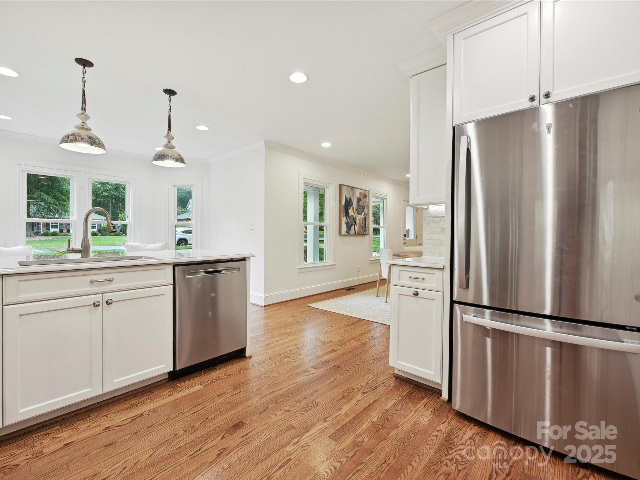 3610 Mill Pond Road Charlotte, NC 28226 - Photo 9 of 35 a kitchen with granite countertop stainless steel appliances a refrigerator and a sink