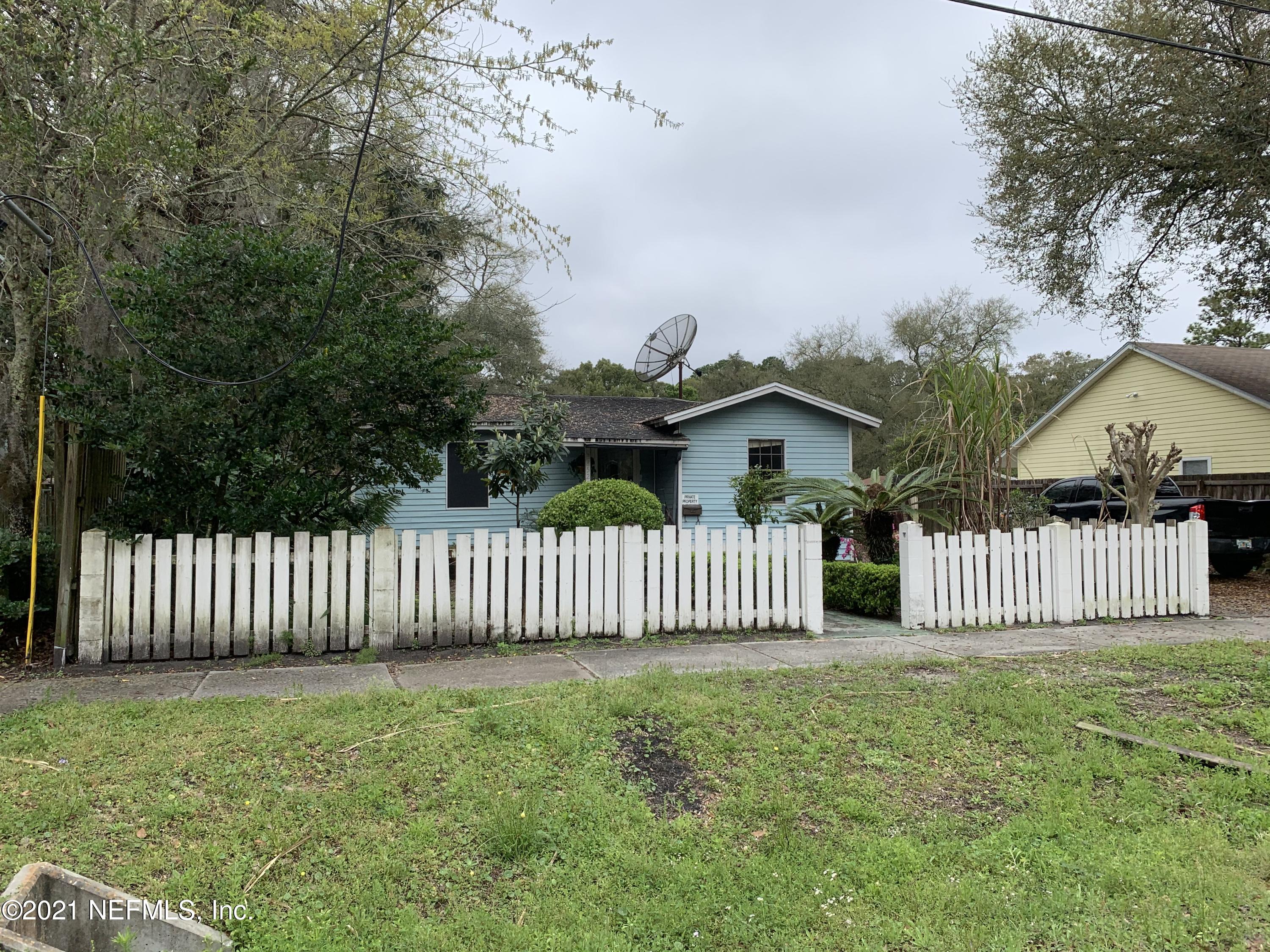 3852 Grant Road Jacksonville, FL 32207 - Photo 1 of 25 a view of a house with wooden fence