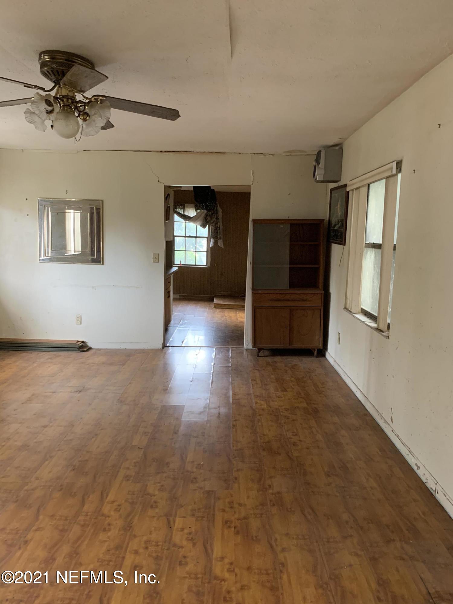 3852 Grant Road Jacksonville, FL 32207 - Photo 13 of 25 wooden floor in an empty room