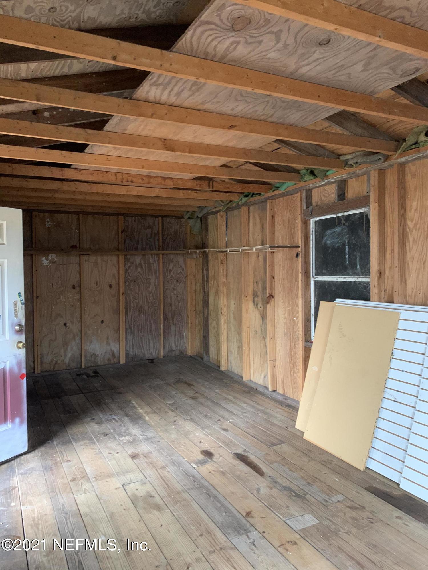 3852 Grant Road Jacksonville, FL 32207 - Photo 23 of 25 a view of a room with wooden walls