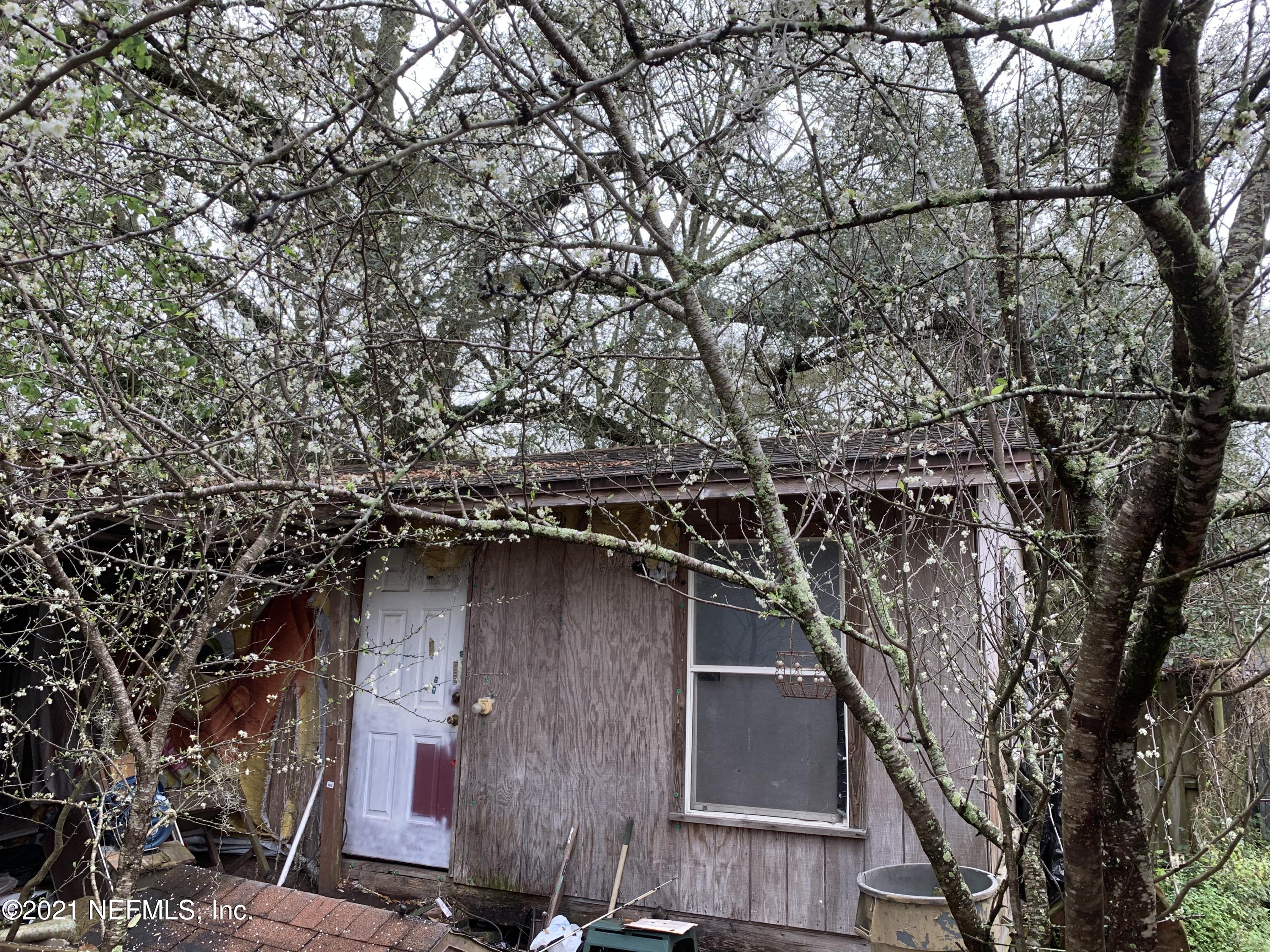 3852 Grant Road Jacksonville, FL 32207 - Photo 25 of 25 a view of a house with a tree