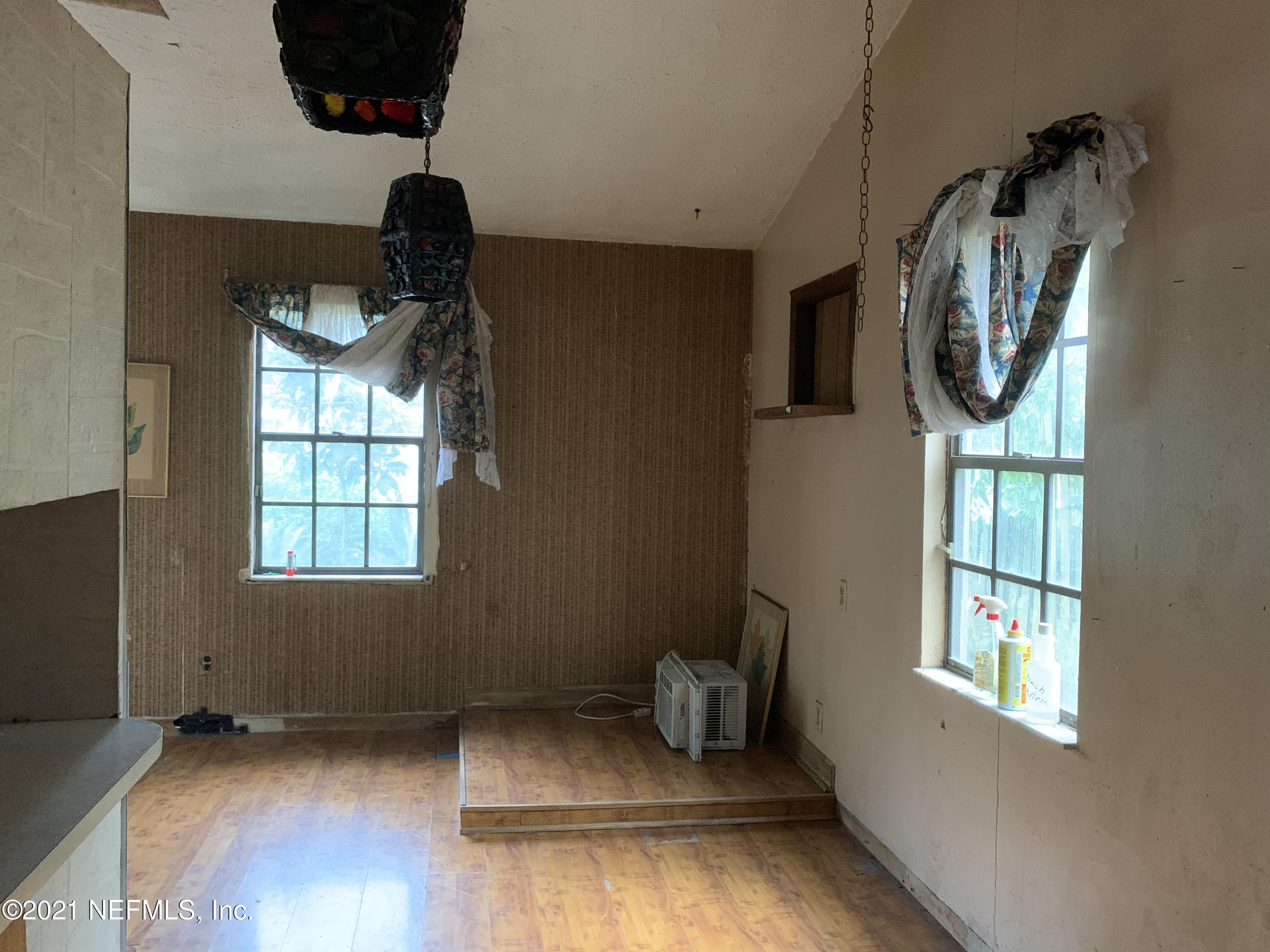 3852 Grant Road Jacksonville, FL 32207 - Photo 8 of 25 a view of entryway and hall with wooden floor