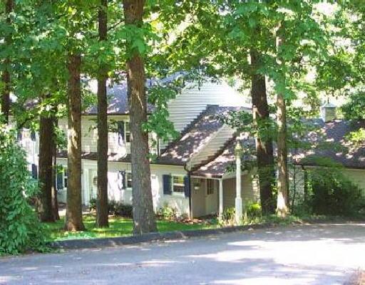 3418 West Ridge Circle Southwest Roanoke, VA 24014 - Photo 1 of 1 a front view of a house with a garden