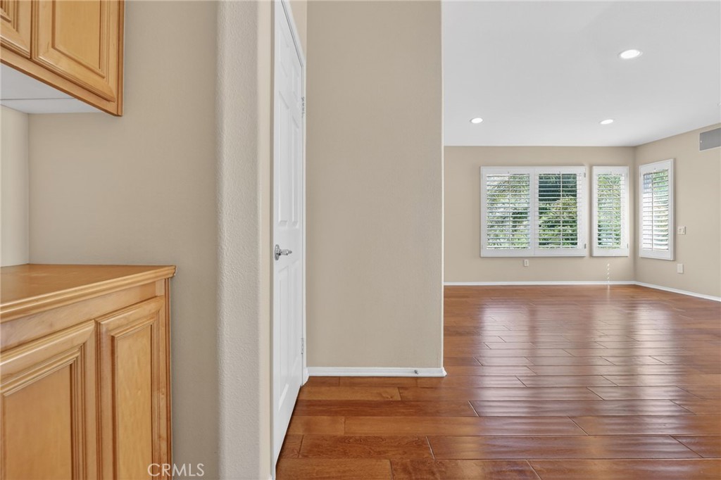 20543 Pesaro Porter Ranch Porter Ranch, CA 91326 - Photo 30 of 67 a view of an empty room with wooden floor and a window