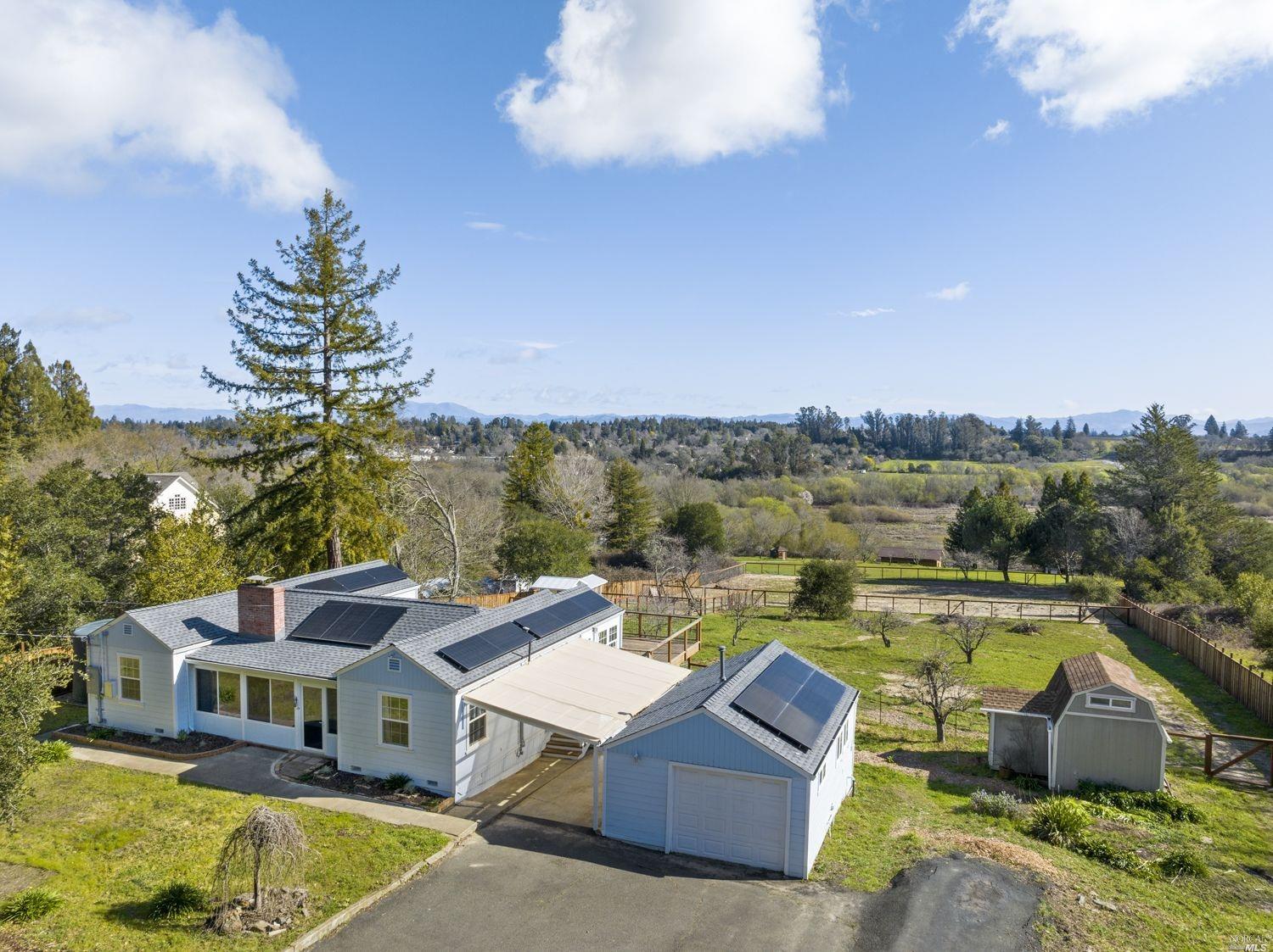 a view of a lake with couches chairs and a table