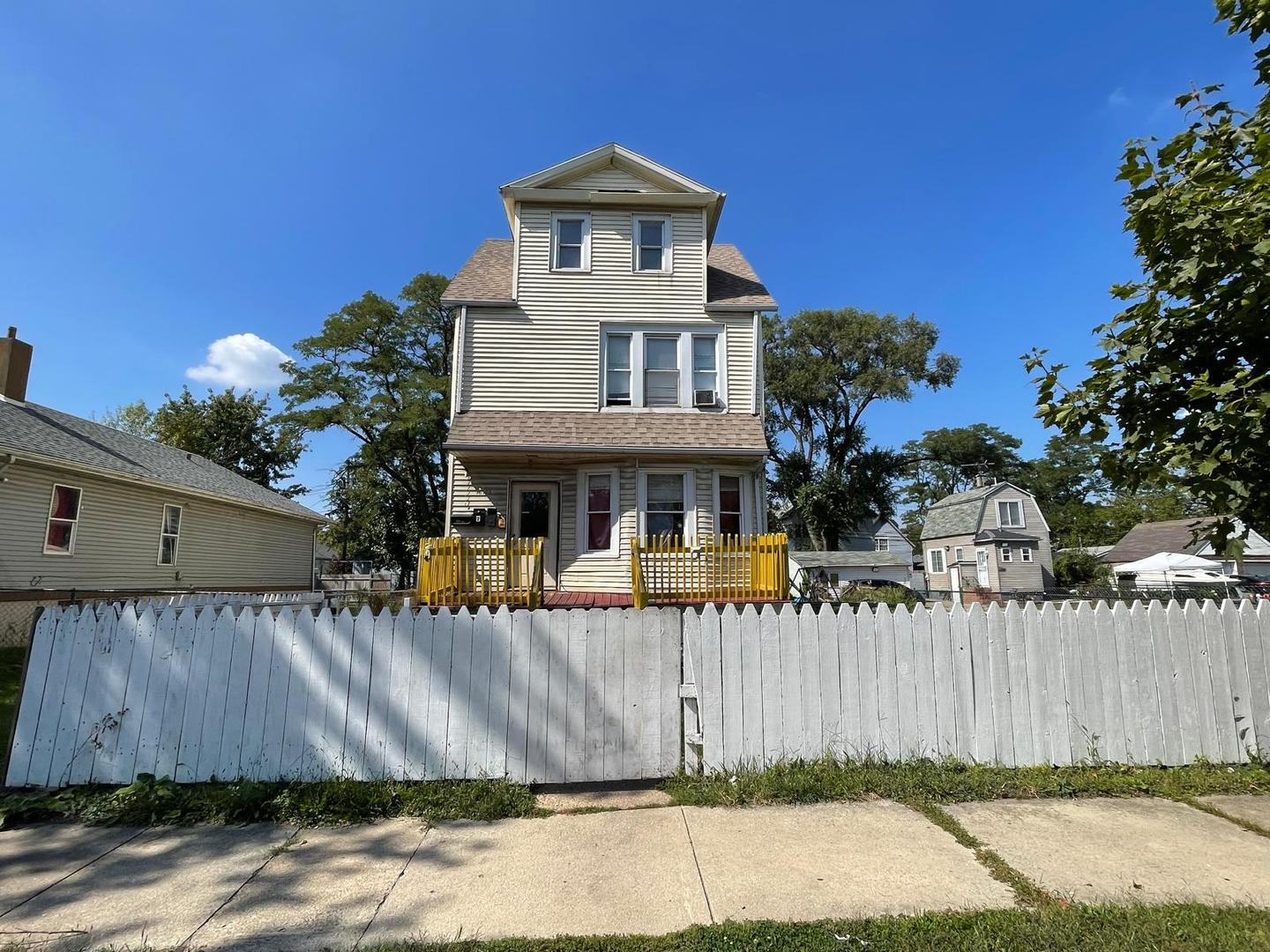 15736 Lathrop Avenue Harvey, IL 60426 - Photo 3 of 20 a front view of a house with a yard