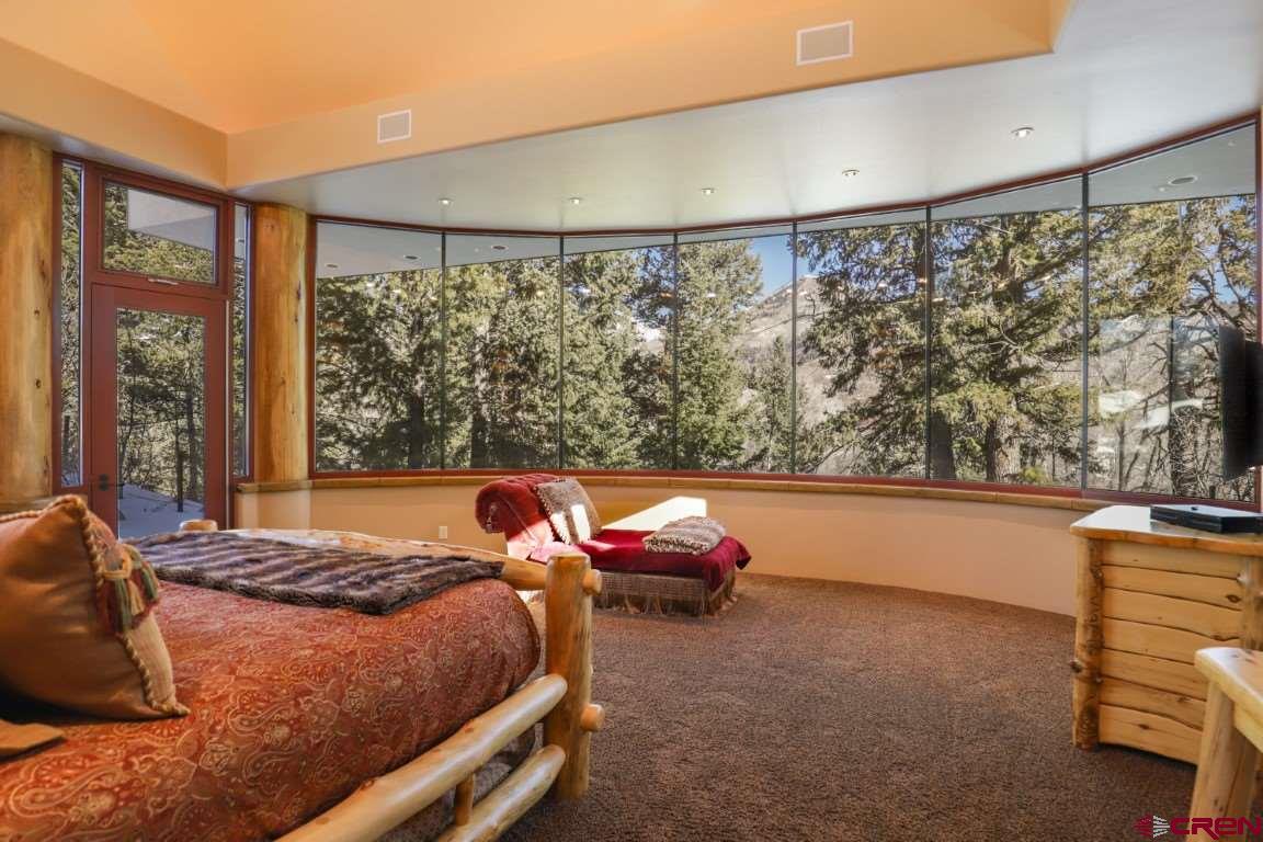 1900 County Road 124 Mancos, CO 81328 - Photo 14 of 35 a bedroom with a bed and a window
