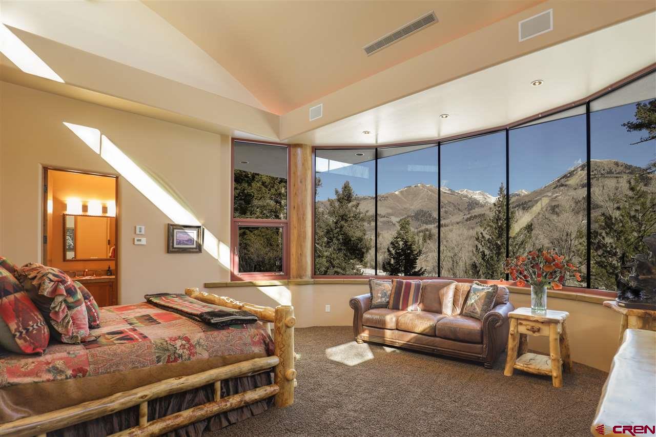 1900 County Road 124 Mancos, CO 81328 - Photo 19 of 35 a bedroom with furniture and a large window