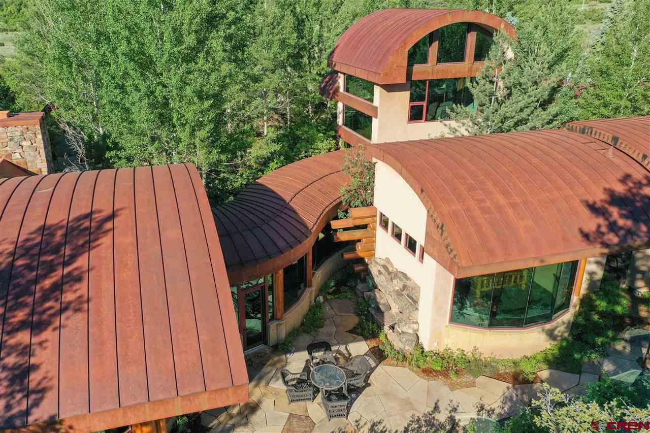 1900 County Road 124 Mancos, CO 81328 - Photo 22 of 35 a aerial view of a house with balcony and trees
