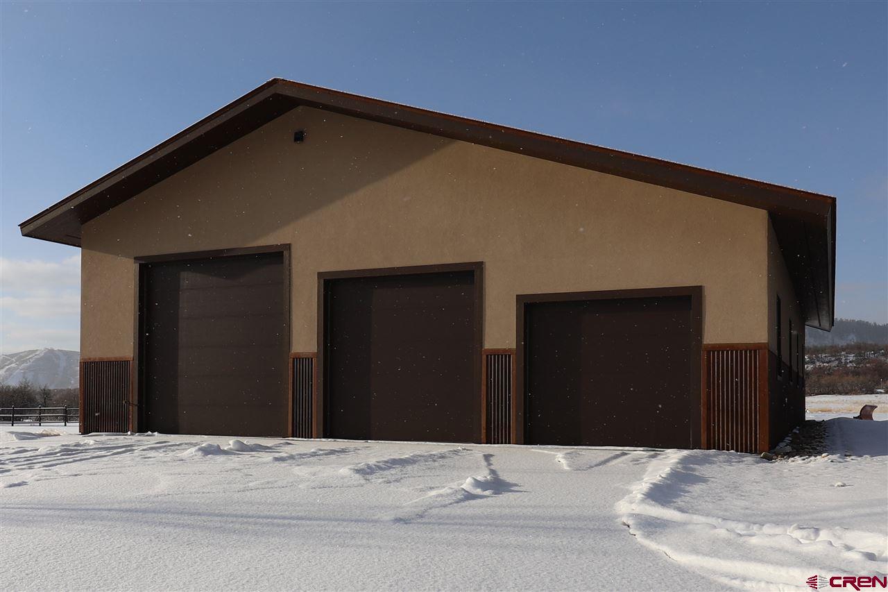 1900 County Road 124 Mancos, CO 81328 - Photo 29 of 35 a black car parked in front of a house
