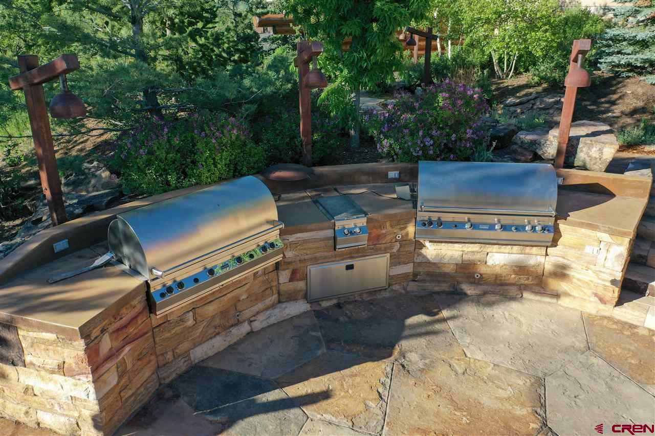 1900 County Road 124 Mancos, CO 81328 - Photo 33 of 35 a view of a patio with table and chairs with wooden fence
