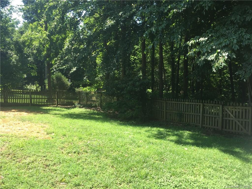 7437 Reedy Creek Road Charlotte, NC 28215 - Photo 14 of 15 a view of a yard with a wooden fence