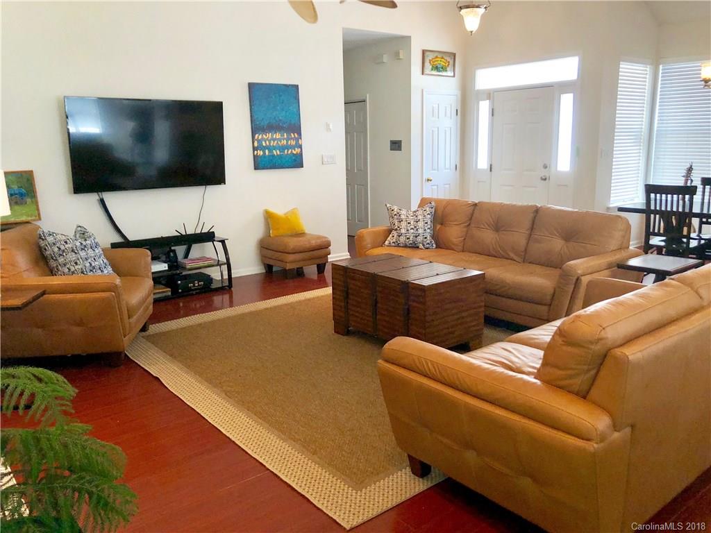 7437 Reedy Creek Road Charlotte, NC 28215 - Photo 3 of 15 a living room with furniture and a flat screen tv