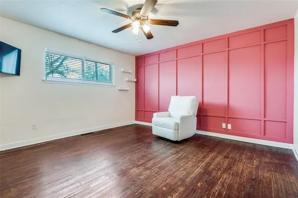 a view of a livingroom with furniture and wooden floor